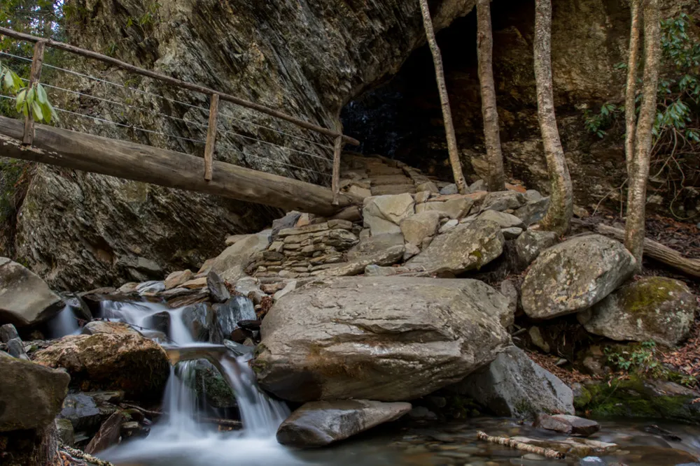 Arch Rock and bridge over waterfall on Alum Cave Trail