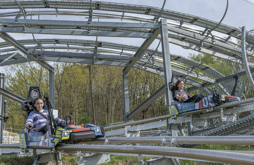 two riders side by side on Pigeon Forge Racing Coaster dual tracks