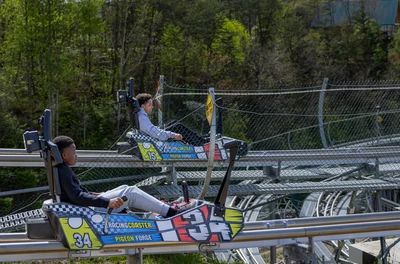 kids racing side by side on the Pigeon Forge Racing Coaster