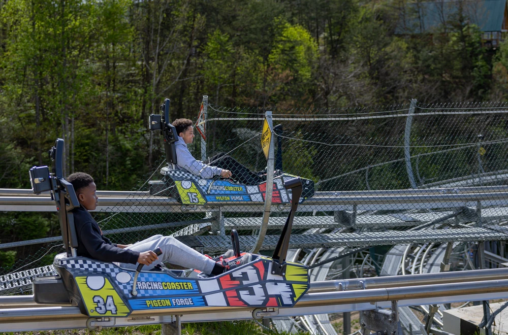 kids racing side by side on the Pigeon Forge Racing Coaster