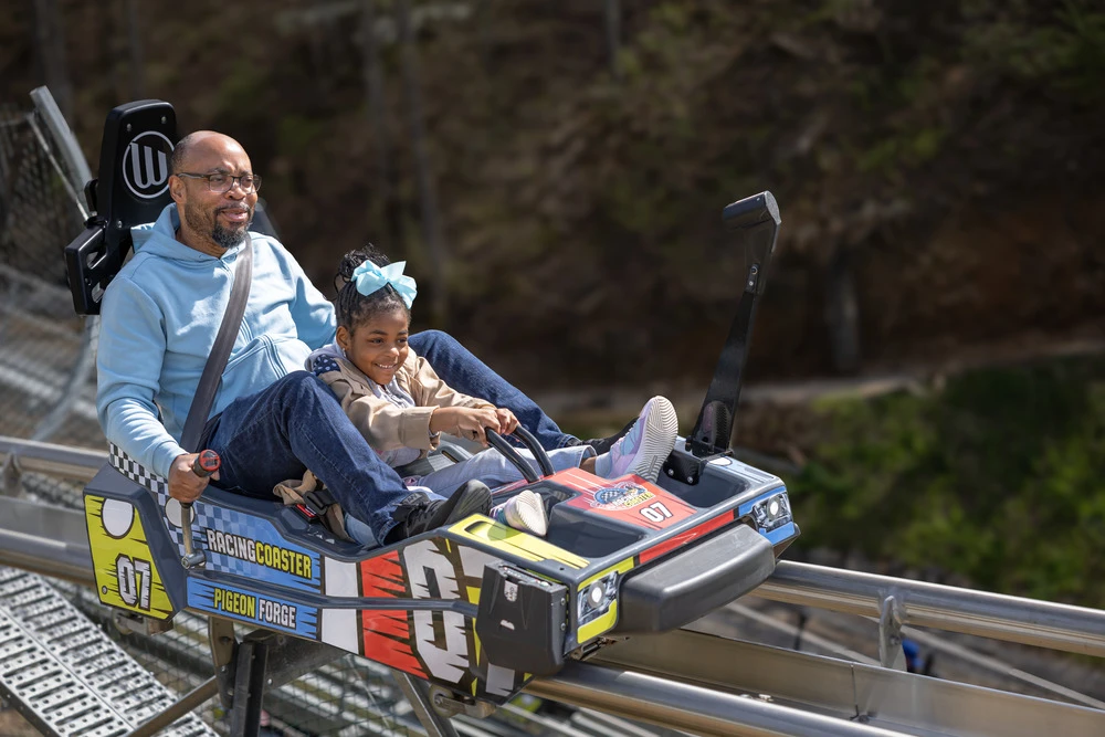 father and daughter riding Pigeon Forge Racing Coaster